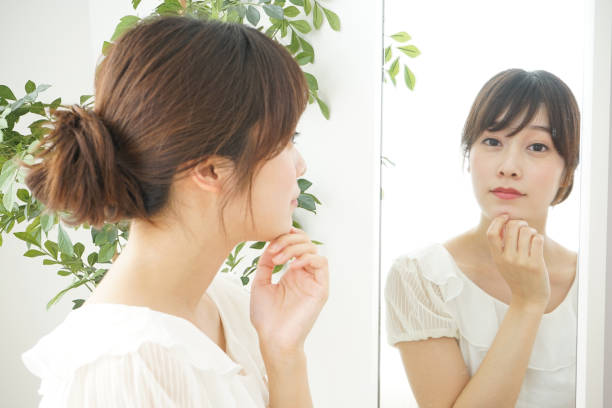 istock Women in front of the mirror 688274728