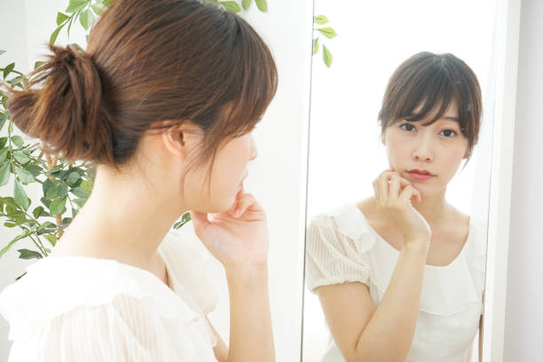 istock Women in front of the mirror 688274732
