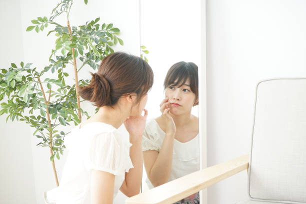istock Women in front of the mirror 688274786
