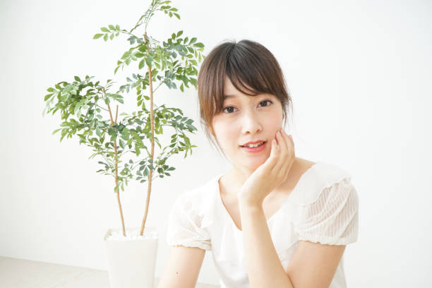 istock Woman touching face 688275360