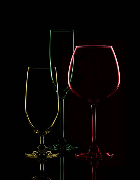 istock Colored transparent glasses for wine on a black background. 688275532