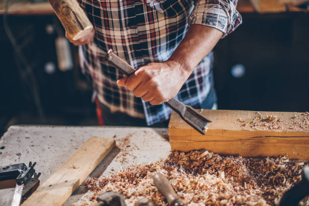 istock Photo of a senior carpenter at work 688278680