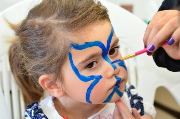 istock Child face painting 688295338