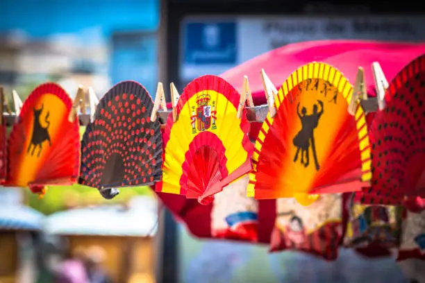 Colorful Spanish Fans arranged for sale in a store