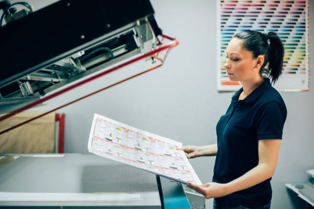 istock Young woman working in printing factory 688306676