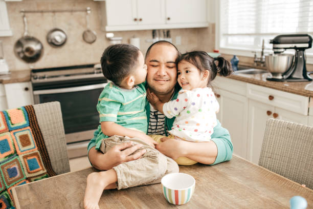 Kissing a best dad Kids hugging a father filipino family stock pictures, royalty-free photos & images