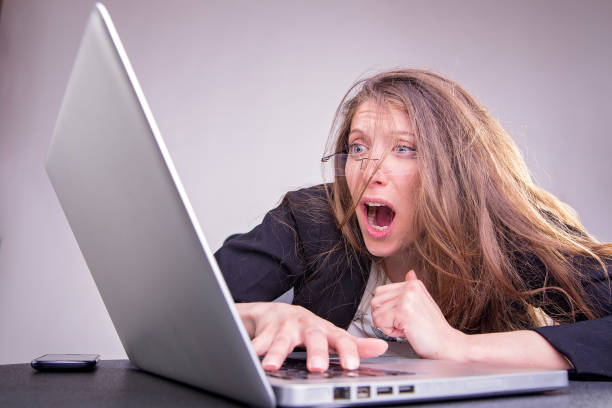 istock Scared, terrified young business woman at her work 688311992