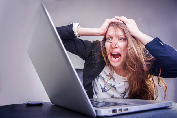 istock Scared, terrified young business woman at her work 688314386