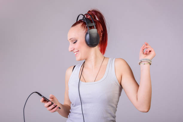 istock Funky woman dancing to the music 688314812
