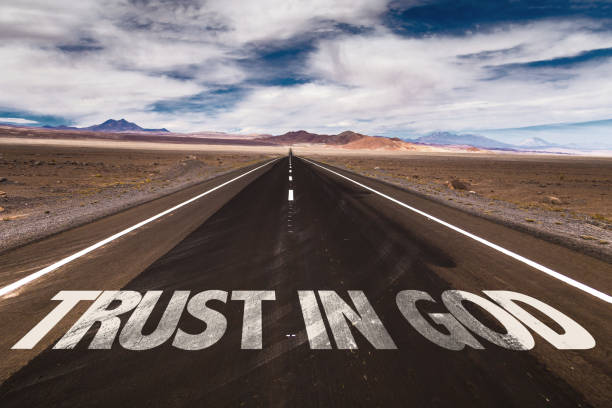 Trust in God sign Trust in God written on desert road trusting god quotes stock pictures, royalty-free photos & images