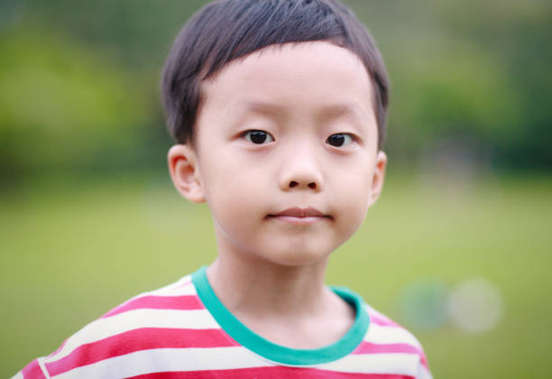 istock The child was lying on the grass 688322436