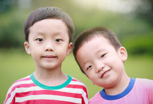 istock Two brothers play in the park 688322558