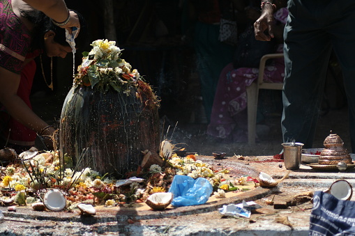 Keesaragutta,Hyderabad,India-February 27: Hindu devotees perform puja to lord siva made out of stone on maha siva ratri day in keesara gutta,Andhra pradesh,India on February,27,2014.