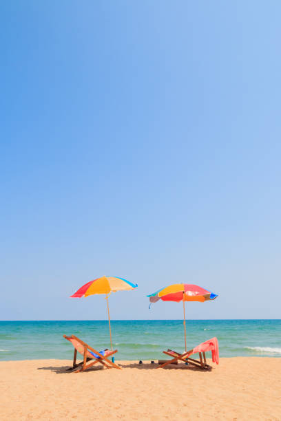 istock Beach chair and umbrella 688325716