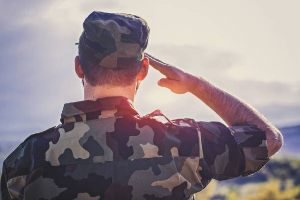 istock Handsome young soldier in the forest 688328982