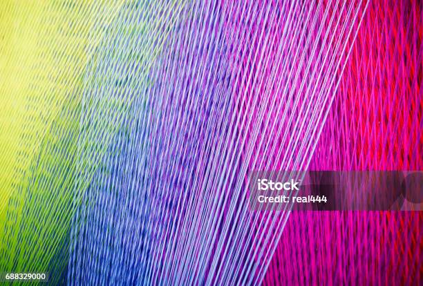 Strands Of Colorful Yarn On A Loom Stock Photo - Download Image Now - Textile, Thread - Sewing Item, Weaving