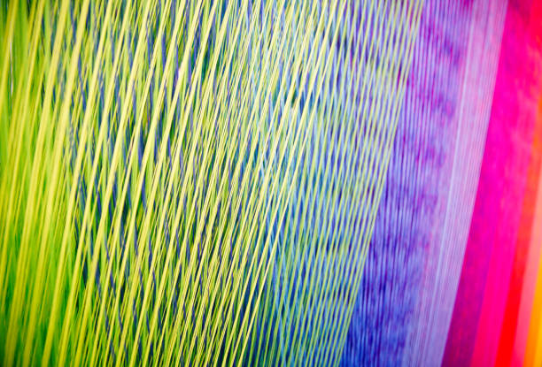 istock Strands of colorful  Yarn on a Loom 688331506