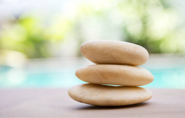 istock Closeup natural white zen stone over blurred background 688334854