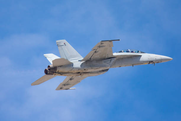 istock F-18 Hornet pitching up, against the blue cloudy sky 688341156