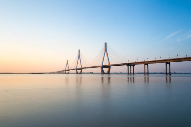istock dongting lake bridge at dusk 688349096