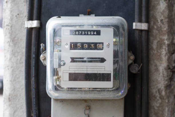 istock Kilowatt hour electricity meter, power supply meter, hour symbol and measuring dial install on pole 688361824