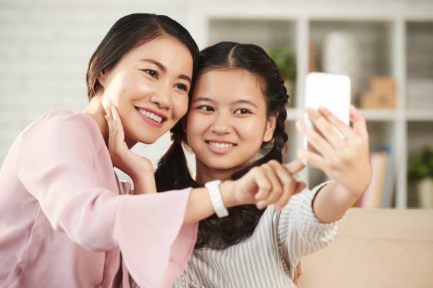 istock Photographing with mother 688362848