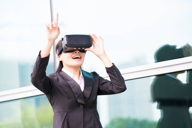 istock asian business woman point pressing touch screen by virtual reality 688368016