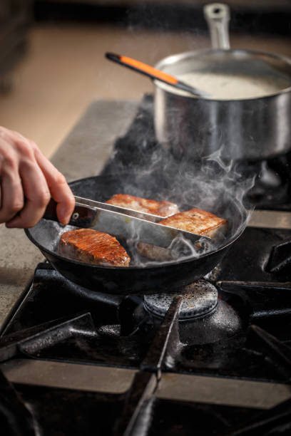 istock Meat frying in the pan 688368234