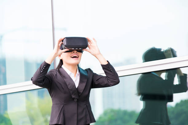 istock asian business woman point pressing touch screen by virtual reality 688368394