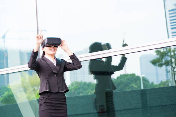 istock asian business woman point pressing touch screen by virtual reality 688368736