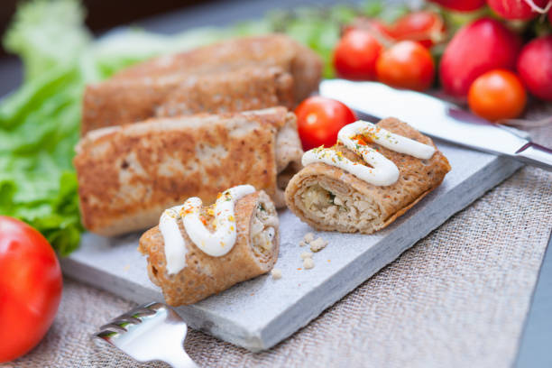 istock Pancakes with meat, fork and knife 688369564