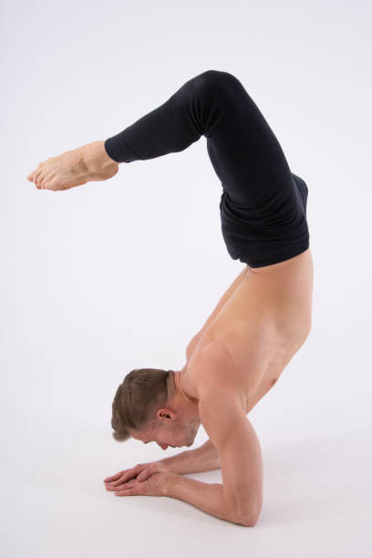 istock An attractive man does yoga. 688372026