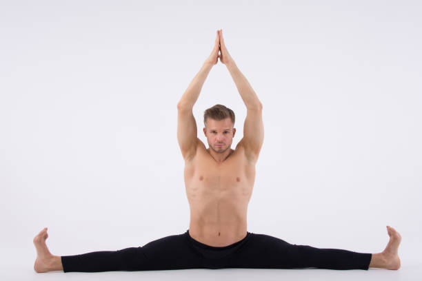 istock To do the splits. An attractive man without a shirt. 688372182