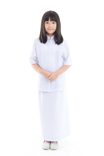 Beautiful Asian girl wearing white dress on white background isolated