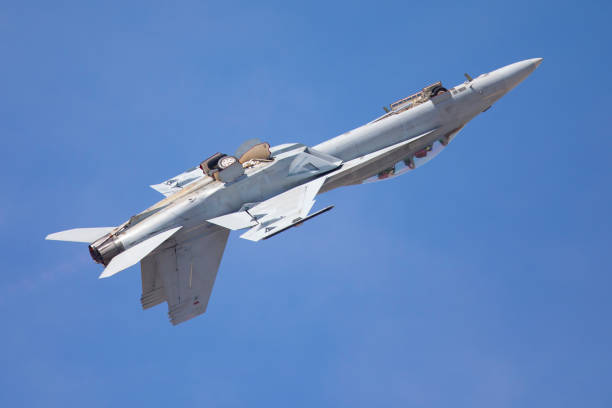 istock Jet in a roll at takeoff, against the blue sky 688377146