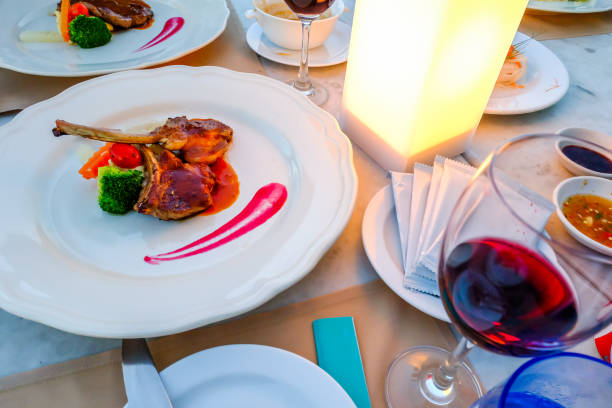 istock luxury Delicious dinner grilled lamb ribs placed on white plate 688379418