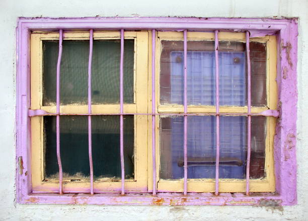 istock Old Window Painted Yellow and Pink 688384328