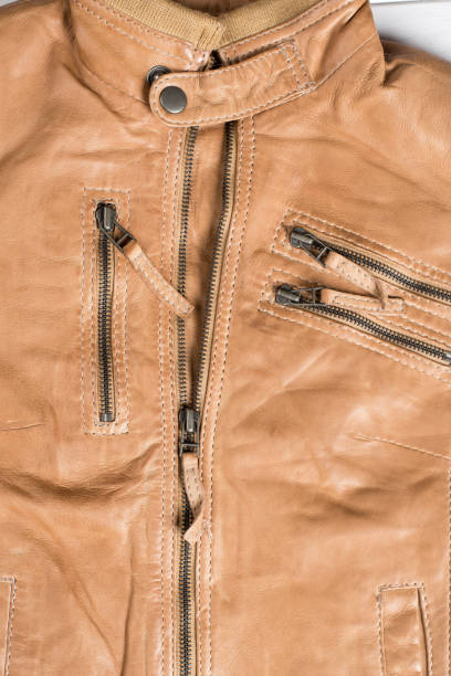 istock Light brown leather jacket. Beige color leather jacket on hanger 688394606