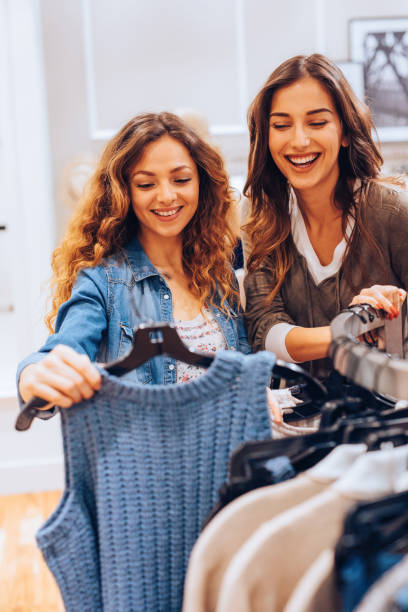 istock Two friends shopping for clothes 688398012