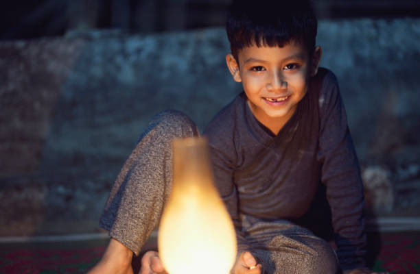 Indian boy with oil lamp