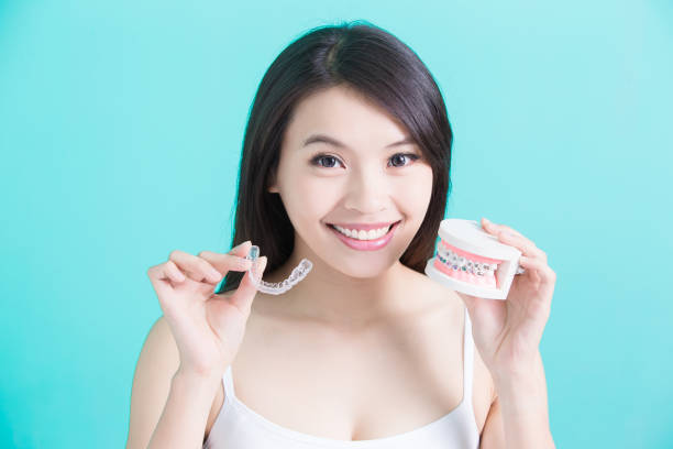 healthy dental concept - clear sky human skin women smiling imagens e fotografias de stock