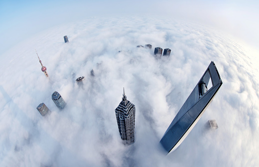 Aerial view of Shanghai skyline and skyscraper in the thick fog at sunrise, China. (Not Taipei 101)