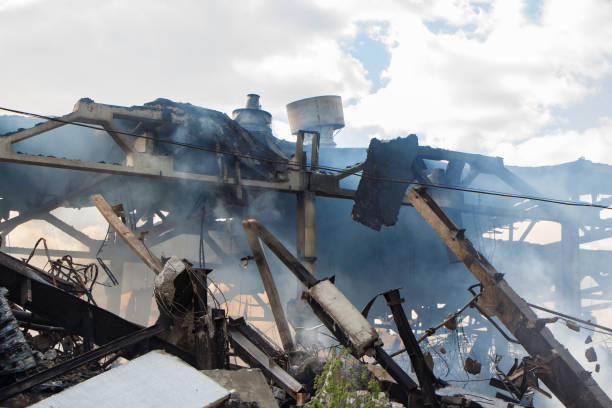 istock Technological disaster, ruined building in smoke 688411880