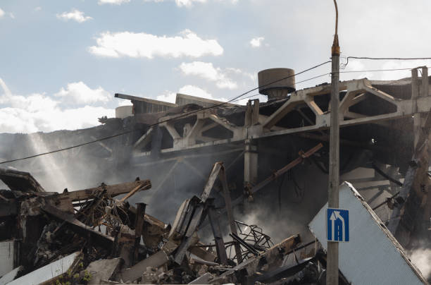 istock Destroyed industrial building in smoke, technological disaster 688411882