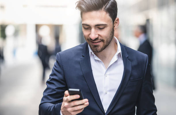 istock Businessman Looking at the Mobile Phone 688416616