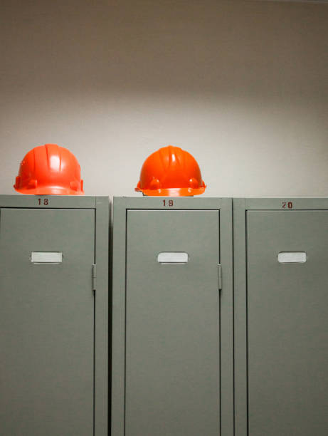 istock Metal lockers and plastic hard hats 688420962
