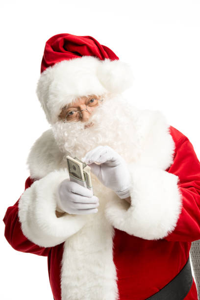 istock Santa Claus counting dollar banknotes 688424046
