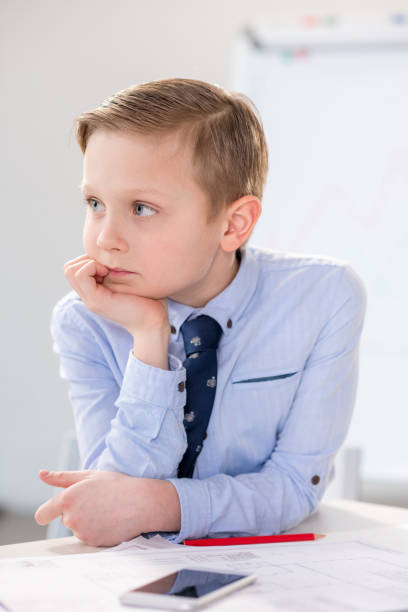 istock Boy in formal clothes portrait 688424230