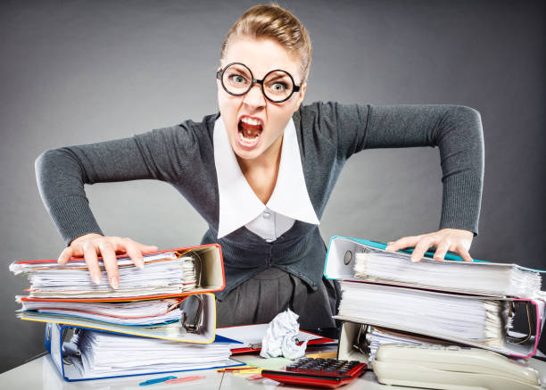 istock Upset secretary at her desk. 688427296