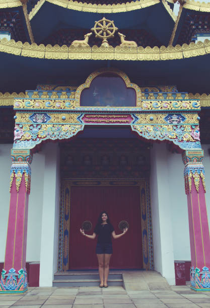 istock Girl Meditating at Buddhist Temple. 688448058